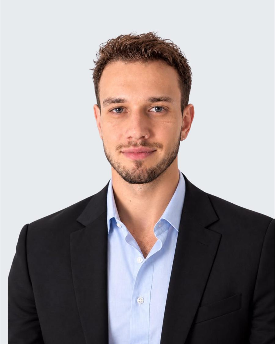 Portrait of Julien Look in a dark blazer and light blue shirt